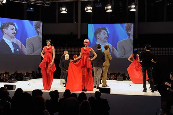 Stage in Schweiz Hairdressing Show models in red dresses