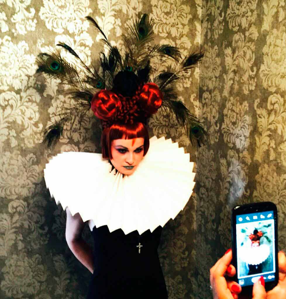 backstage snap of award winning photograph ginger and peacock feather hair